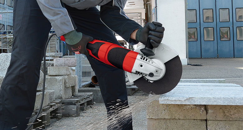 cabled angle grinder in use